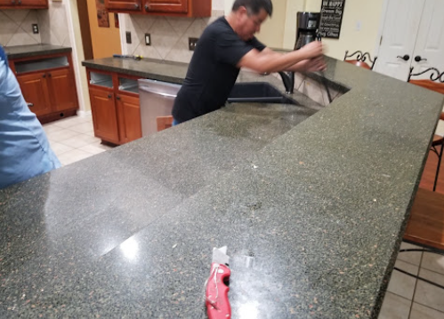 Countertop installation during kitchen renovation
